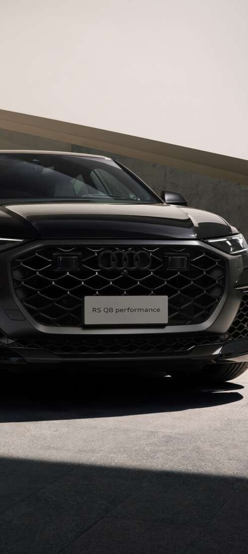 A sleek black Audi RS Q8 luxury performance SUV presented in a high-quality, cinematic... Motorola Moto G56 5G free wallpaper
