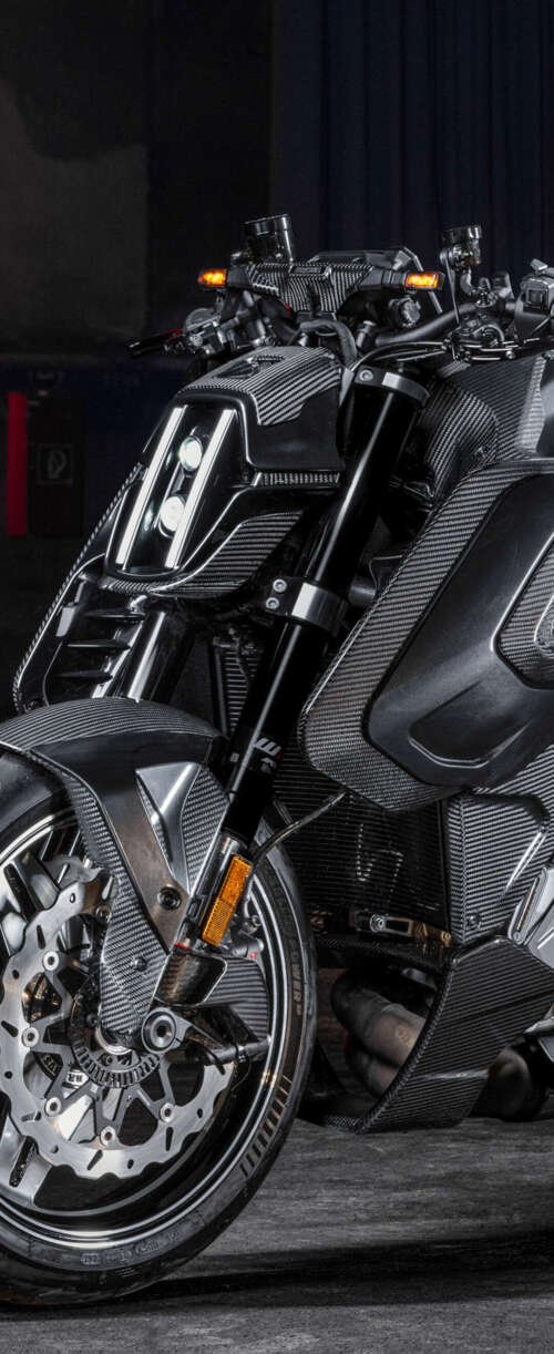 A futuristic Brabus 1400 R Signature Edition motorcycle featuring extensive carbon... hd background