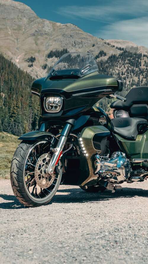 A high-resolution, detailed close-up of a 2026 Harley-Davidson Street Glide motorcycle... Apple iPhone SE 2022 free hd wallpapers