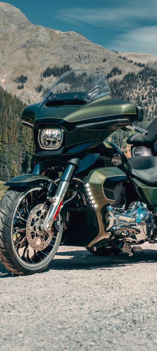 A high-resolution, detailed close-up of a 2026 Harley-Davidson Street Glide motorcycle... Infinix Smart 10