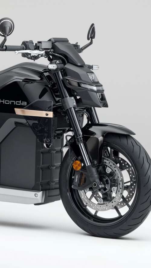 Close-up shot of the Honda WN7 electric motorcycle showcased at the EICMA Motorcycle... Apple iPhone SE 2022 hand phone wallpaper