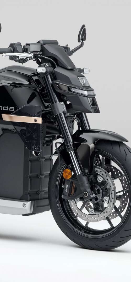 Close-up shot of the Honda WN7 electric motorcycle showcased at the EICMA Motorcycle... Samsung Galaxy S26 Ultra background images hd