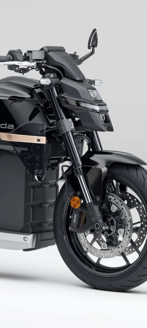 Close-up shot of the Honda WN7 electric motorcycle showcased at the EICMA Motorcycle... Infinix Smart 10 download free phone wallpaper