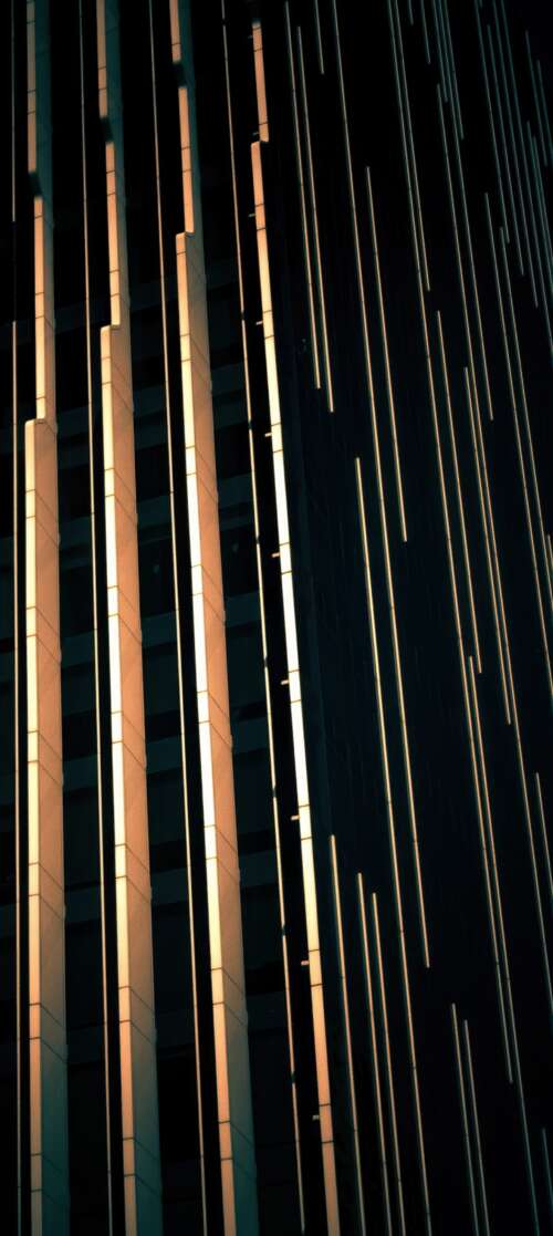 A dark, modern glass building in Abu Dhabi showcasing contemporary architectural... Motorola Moto G56 5G background images hd