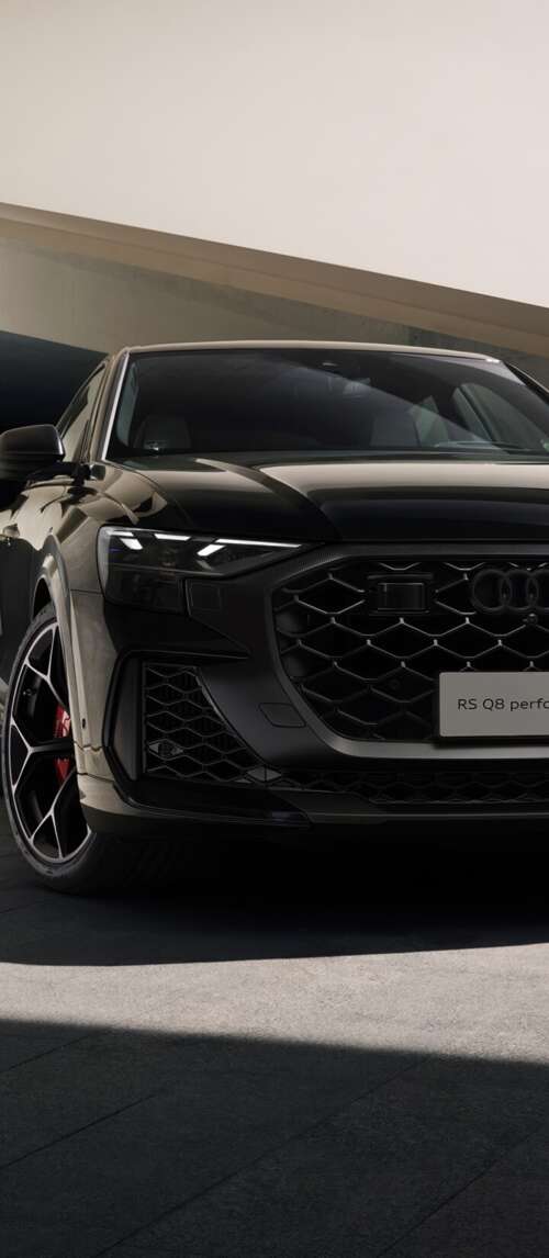 A high-performance black Audi RS Q8 luxury SUV in high resolution wallpaper download