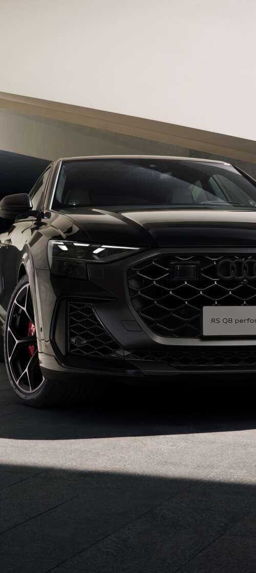 A high-performance black Audi RS Q8 luxury SUV in high resolution Motorola Moto G56 5G wallpaper download