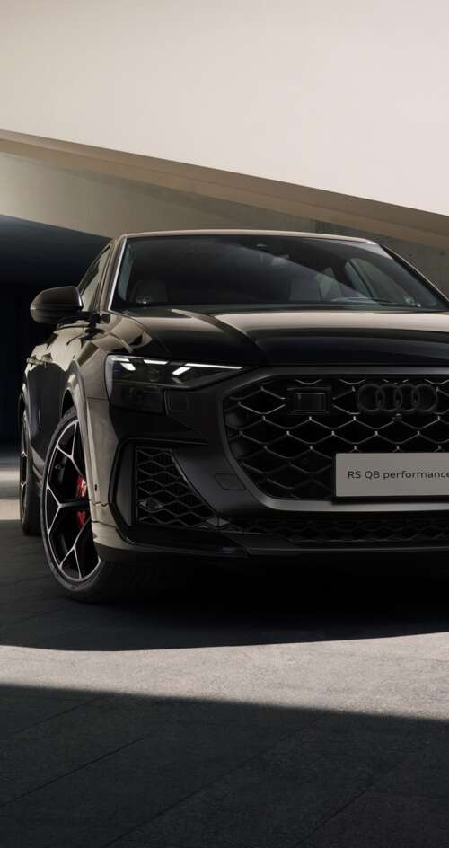 A high-performance black Audi RS Q8 luxury SUV in high resolution Sharp Aquos C10 wallpaper download