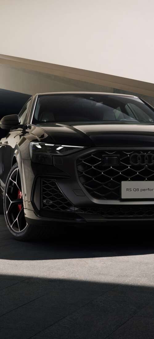 A high-performance black Audi RS Q8 luxury SUV in high resolution Honor X70 wallpaper download