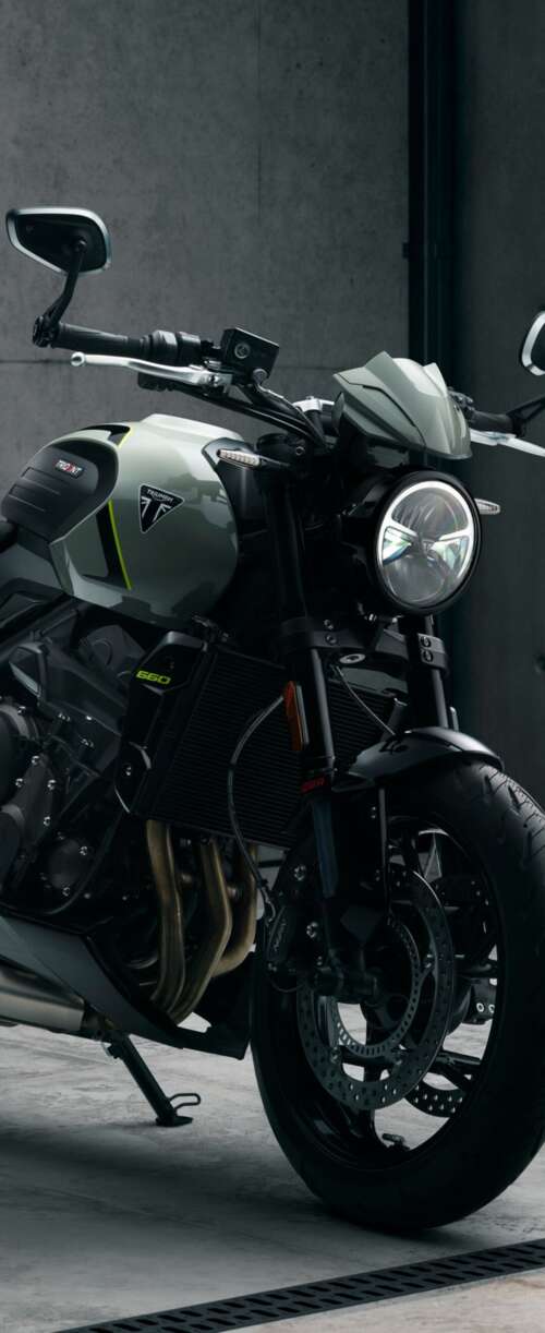 A muscular black Triumph Trident 660 street motorcycle with a sleek, modern design. Samsung Galaxy Z Flip7 FE wallpaper photo gallery download
