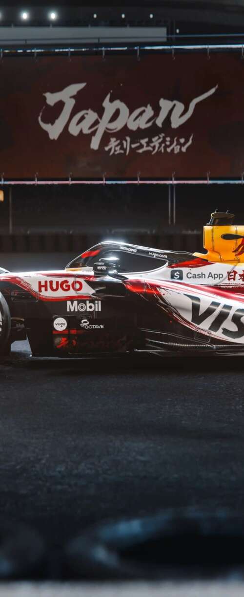The VCARB 03 Formula One car racing through the tracks of the Suzuka circuit during... Samsung Galaxy Z Flip7 FE mobile wallpaper