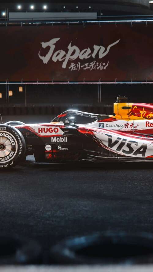 The VCARB 03 Formula One car racing through the tracks of the Suzuka circuit during... Apple iPhone SE 2022 download free wallpaper for phone