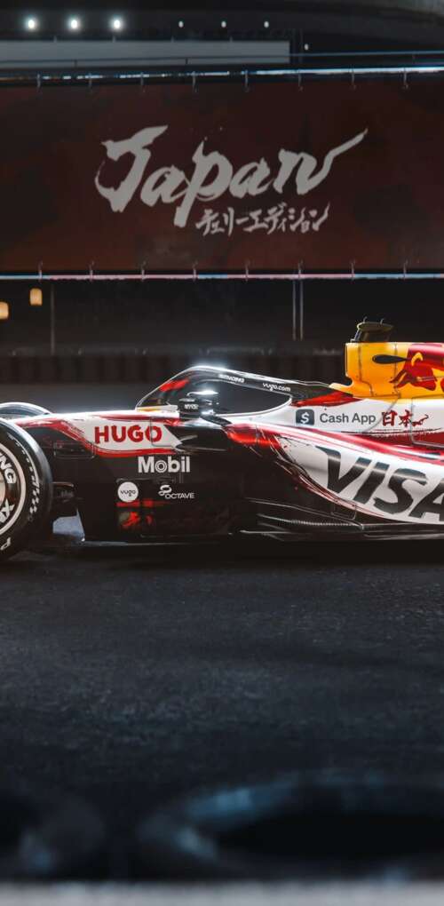 The VCARB 03 Formula One car racing through the tracks of the Suzuka circuit during... Huawei Mate 30 Pro download free phone wallpaper