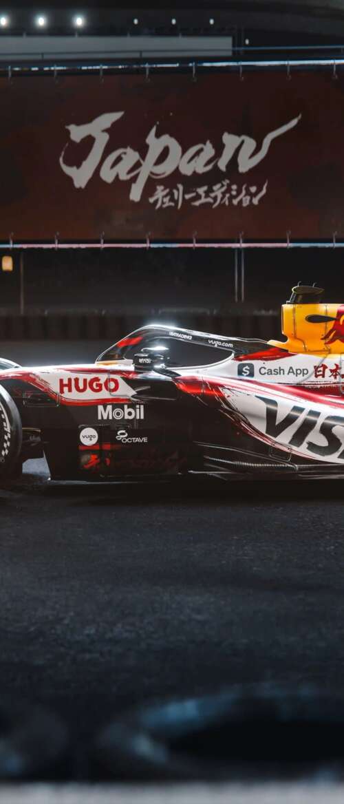 The VCARB 03 Formula One car racing through the tracks of the Suzuka circuit during... nubia Flip 3 wallpaper download