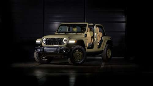 A high-resolution 5K image of a 2025 Jeep Wrangler Unlimited positioned against a... wallpaper