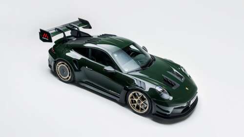 A high-detail studio shot of a Porsche 911 GT3 RS equipped with a Manthey Performance... wallpaper