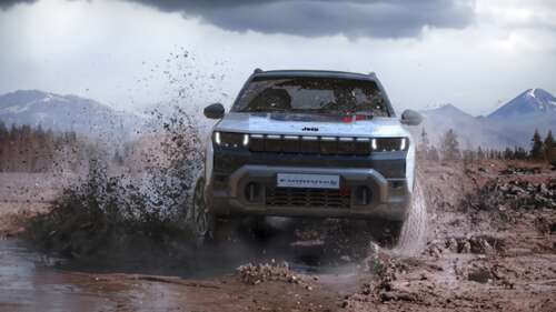 A modern 2025 hybrid SUV splashing through water on an off-road trail. wallpaper