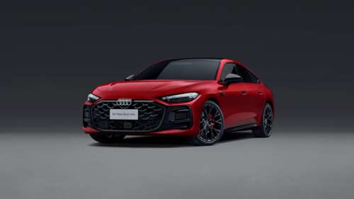 A high-resolution image of a polished red luxury sedan against a solid grey background. wallpaper
