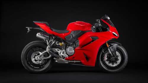 A high-resolution, cinematic shot of a 2025 Ducati Panigale V2 sport motorcycle positioned... wallpaper