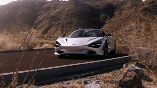 A high-detail shot of a McLaren 750S Spider super car positioned on a dark tarmac... wallpaper