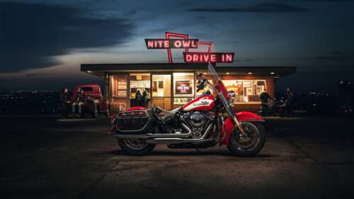 A highly detailed view of a classic Harley-Davidson Hydra-Glide motorcycle at night,... free wallpaper