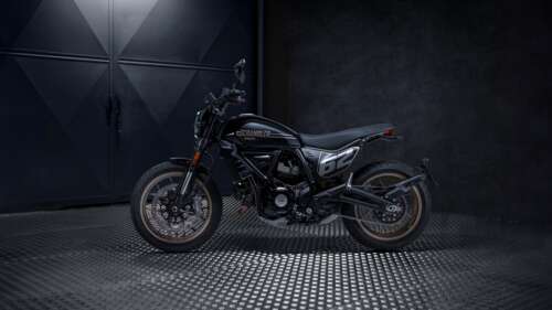 A high-detail 5K shot of a 2025 Ducati Scrambler Full Throttle motorcycle featuring... free hd wallpapers