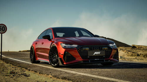 ABT RS7-R Audi RS7 luxury performance car parked on an outdoor asphalt road. wallpaper