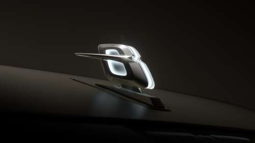 A high-detail close-up of the Bentley EXP 15 logo on a dark, minimalist background. wallpaper