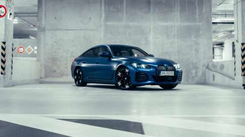 A highly detailed 5K close-up of a BMW i4 electric luxury sedan. wallpaper