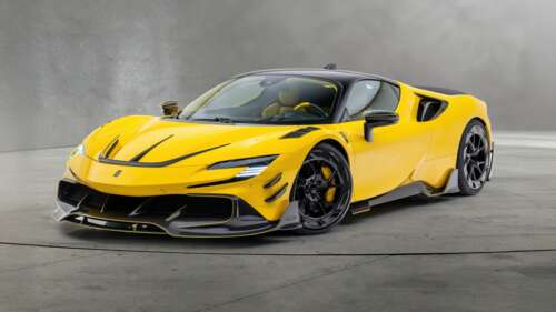 A high-detail shot of a yellow Ferrari SF90 with a Mansory custom body kit. wallpaper