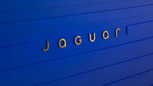 A minimalist and sophisticated jaguar logo in shades of French Ultramarine blue. wallpaper