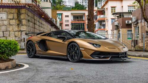 A high-detail, cinematic shot of a Lamborghini Aventador SVJ Roadster sports car. wallpaper