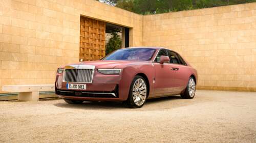 A high-resolution, detailed close-up of a sleek and polished Rolls-Royce Ghost luxury... wallpaper