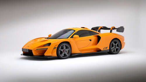 A high-quality CGI visualization of a McLaren Senna LM sports car featuring aerodynamic... wallpaper