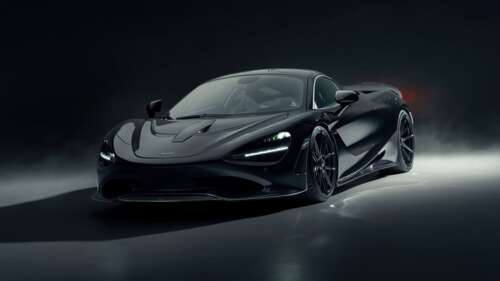 High-performance black cars positioned in a dark, atmospheric setting with dramatic... wallpaper