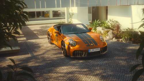 A sleek, modern interpretation of a classic Porsche 911 Spirit 70 sports car in a... wallpaper