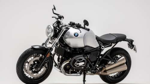 A detailed shot of the 2023 BMW R nineT Final Edition motorcycle in white. free background