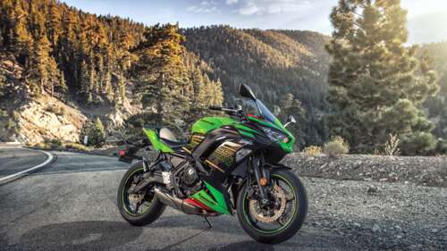 A high-detail view of a 2023 Kawasaki Ninja 650 motorcycle showing its sleek design... wallpaper