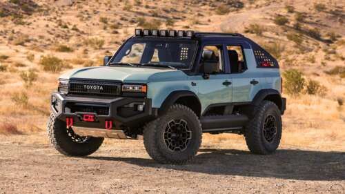 A sleek and powerful 2024 off-road SUV navigating a rugged, rocky terrain. free wallpaper