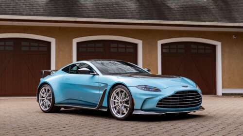A high-detail 5K shot of the 2024 Aston Martin V12 Vantage sports car showcasing... wallpaper