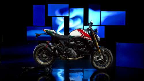 A cinematic, high-detail close-up of the 2024 Ducati Monster Anniversary Edition... wallpaper
