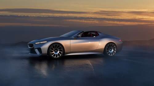 A sleek, aerodynamic 2024 concept roadster car with futuristic design elements and... free wallpaper
