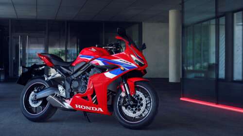 A sleek 2024 Honda CBR650R sports touring motorcycle showcasing its aerodynamic bodywork. wallpaper
