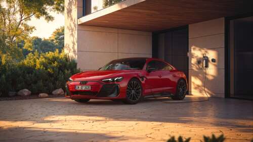 A sleek, vibrant red 2025 Audi e-tron GT quattro luxury electric car. wallpaper