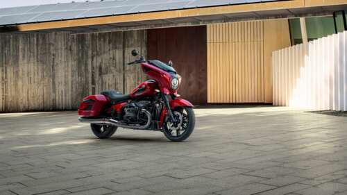A close-up shot of a red 2025 BMW R 18 touring motorcycle showcasing its metallic... wallpaper