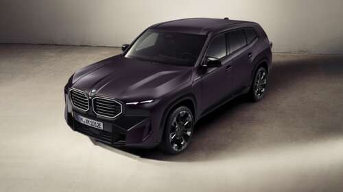 A stunning close-up of the 2025 BMW XM luxury plug-in hybrid SUV in high detail. wallpaper