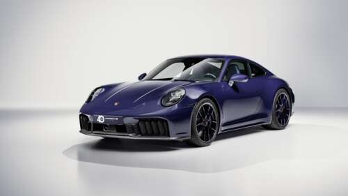 A pristine 2025 Porsche 911 Carrera GTS Special Edition sports car centered against... wallpaper