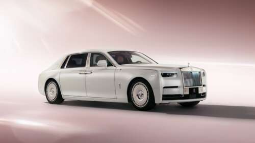 A 2025 Rolls-Royce Phantom EWB luxury sedan positioned against a soft, aesthetic... wallpaper