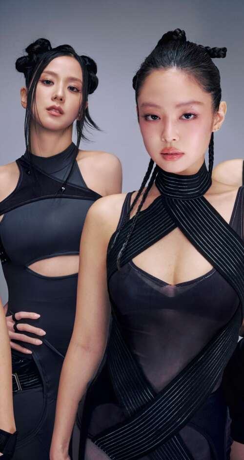 Four members of Blackpink (Jisoo, Lisa, Rosé, and Jennie) posing together wearing...