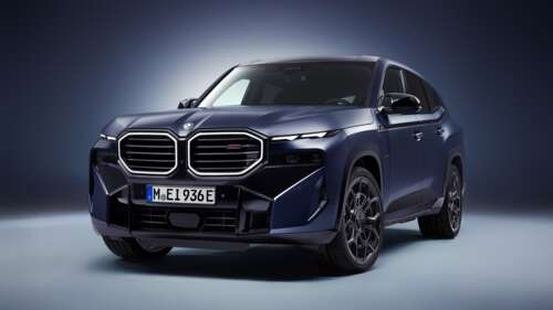 A premium BMW XM luxury SUV featured in high resolution against a solid blue background. wallpaper download