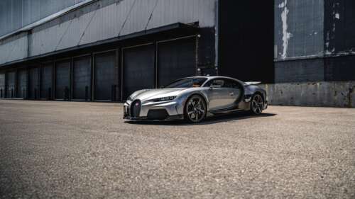 A Bugatti Chiron Super Sport hypercar parked in an outdoor setting. wallpaper